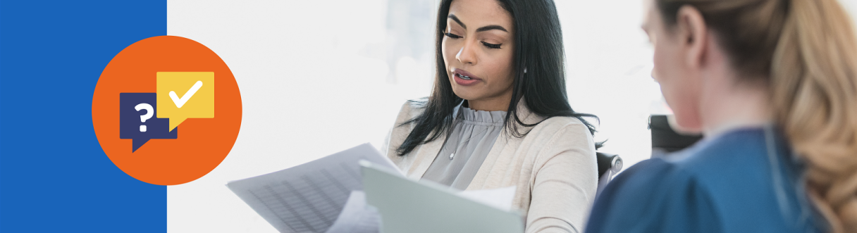 Two women looking over documents