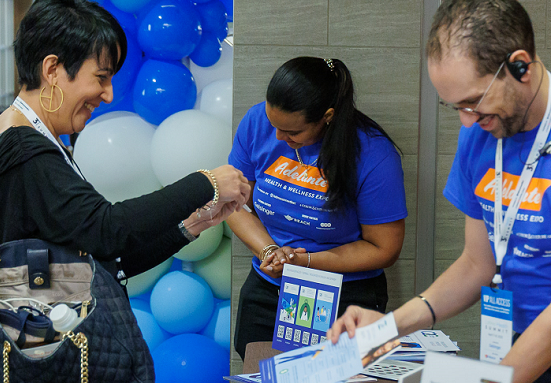 Smiling woman receives information pamphlets