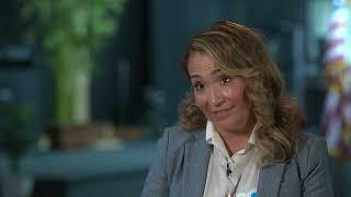 Watch on YouTube: Initial screenshot of Gloria's story video, showing one of her care partners speaking about her participation in the InCK Model